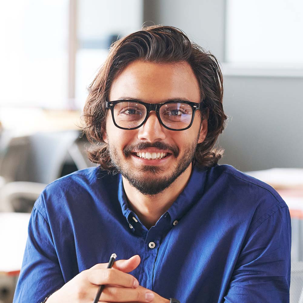 Portrait of successful marketing expert in office